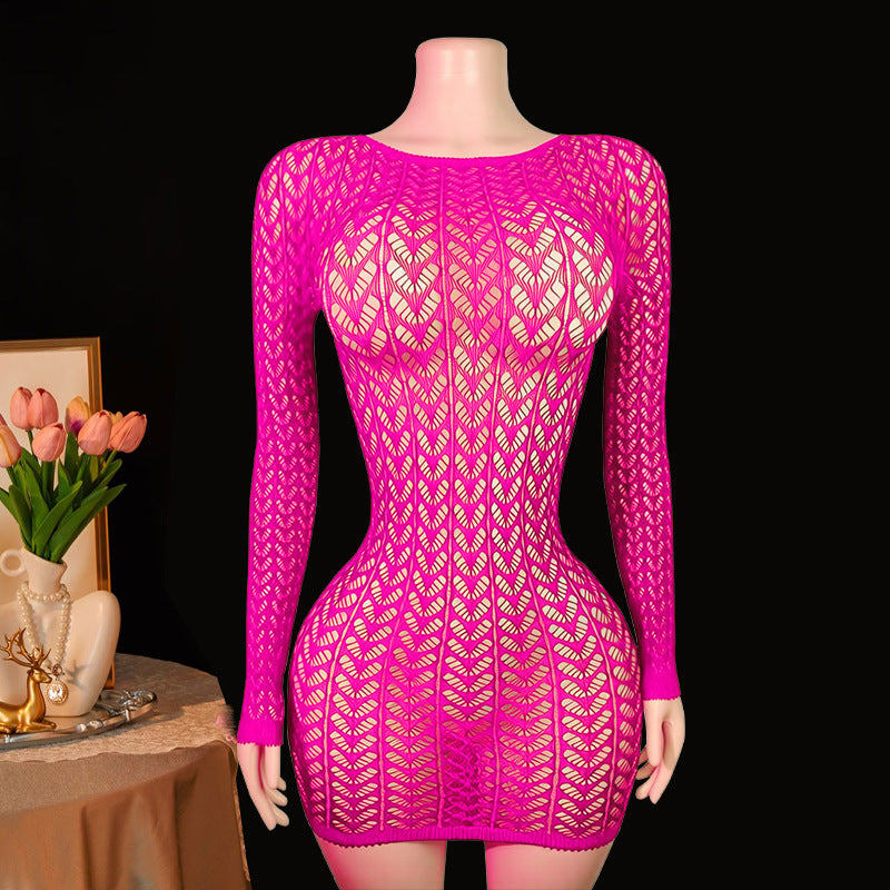 Hot pink fishnet mini dress on mannequin – dark background lifestyle shot
