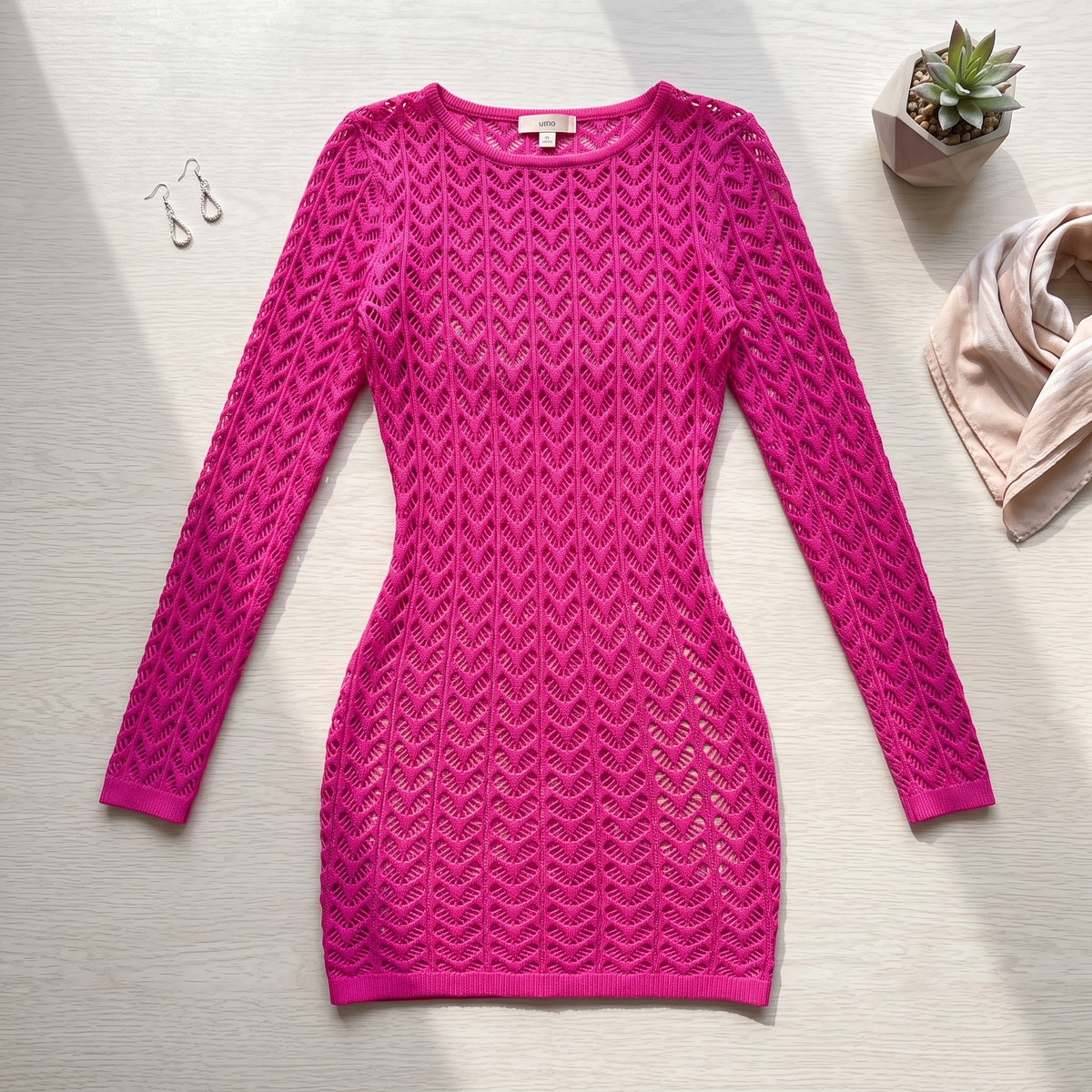 Hot pink fishnet mini dress – product flat lay